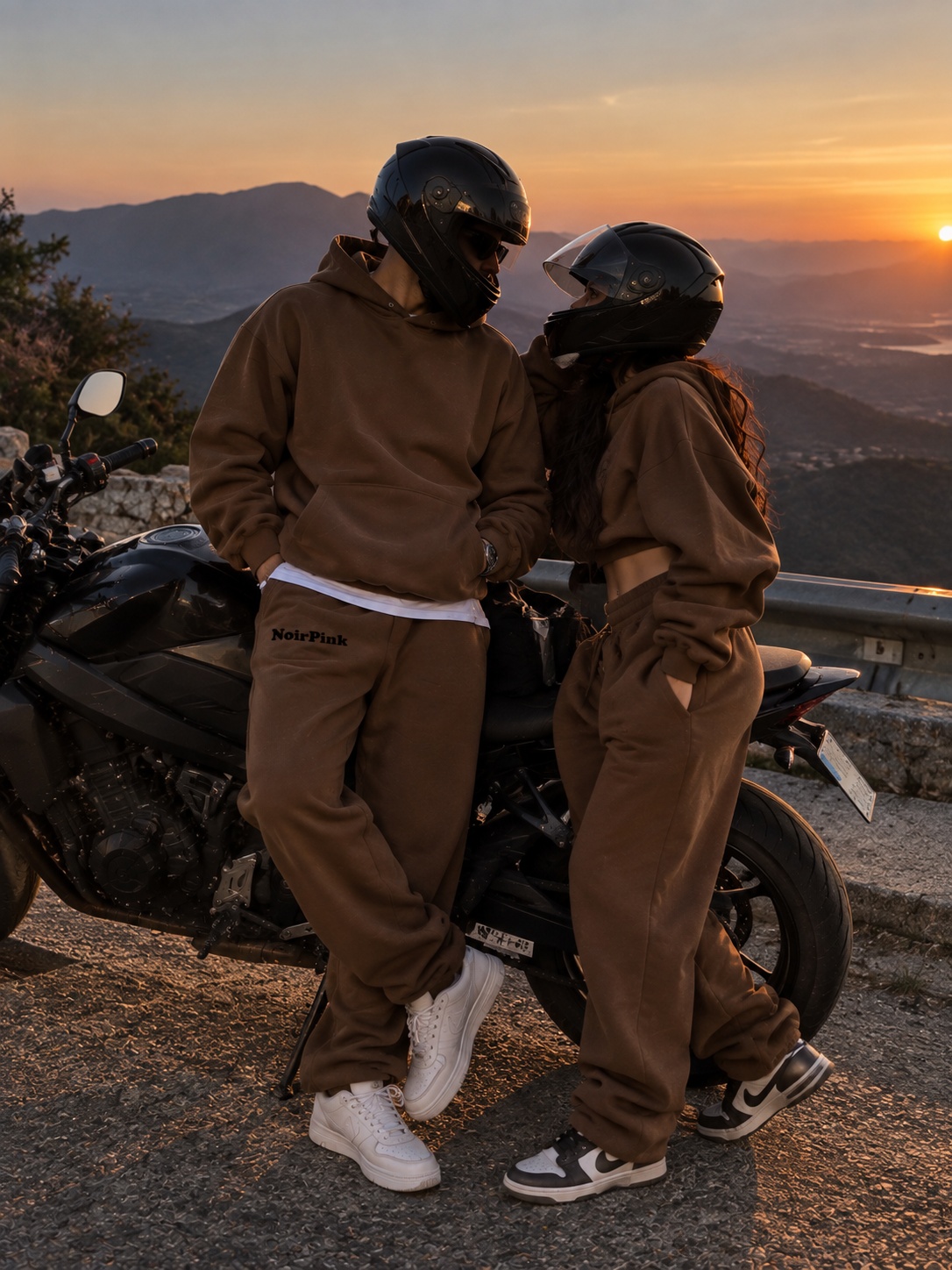 Couple in matching NoirPink Noir Mocha sets at sunset